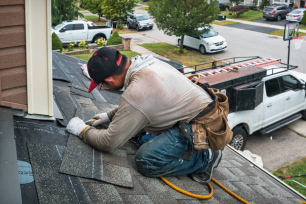 Professional Roofing technician working in Skandia, MI